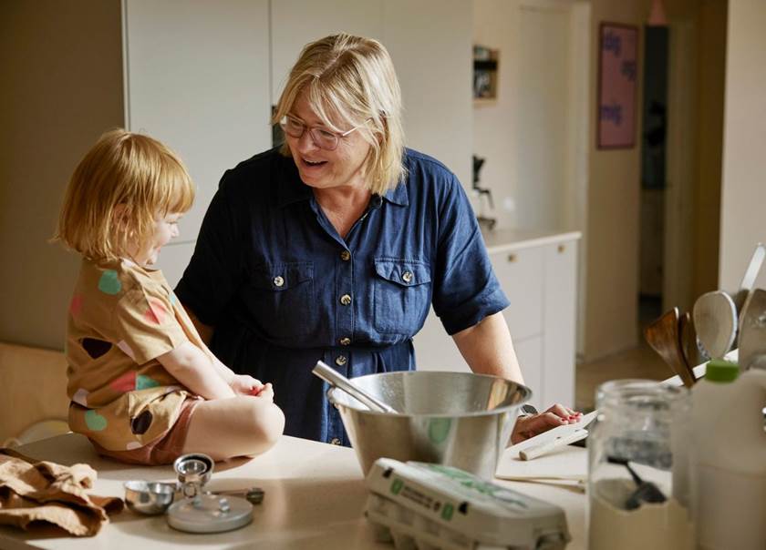 Grandmother cooking with grand child