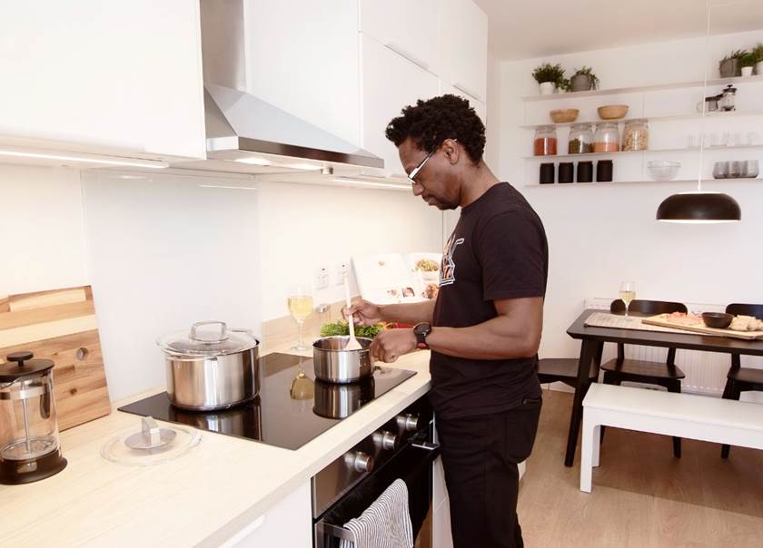 man standing in kitchen
