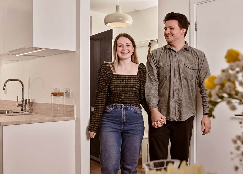 Couple walking into BoKlok kitchen Couple walking into BoKlok kitchen