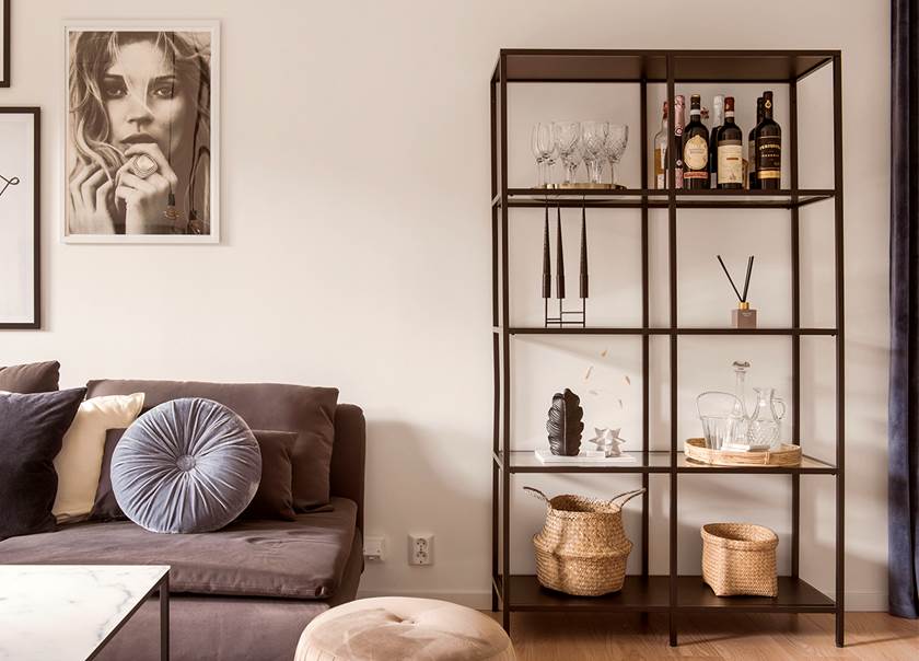 Lounge with tall IKEA black and glass storage unit Lounge with tall IKEA black and glass storage unit