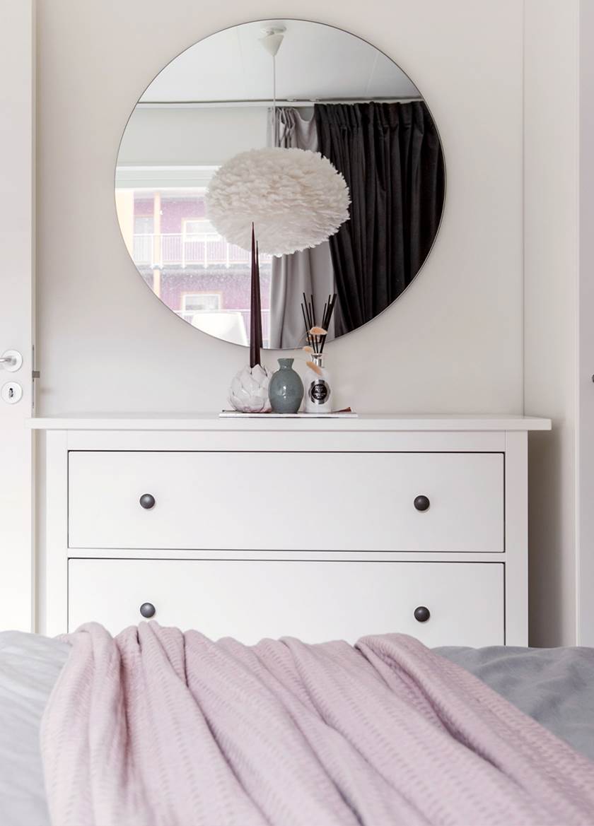 White chest of draws with round mirror above White chest of draws with round mirror above