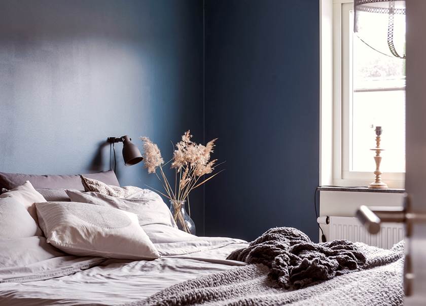 Bedroom with blue colored walls in the home of the Johansson-Jonsson family. Bedroom with blue colored walls in the home of the Johansson-Jonsson family.