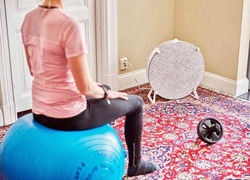 Woman sat on blue exercise ball