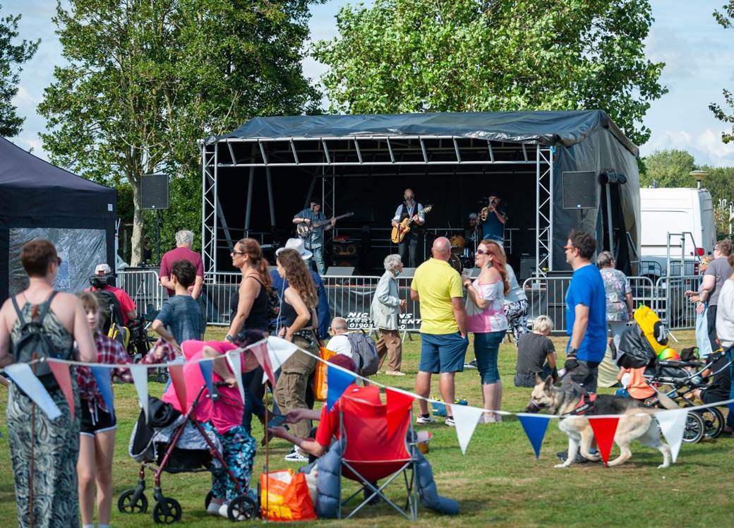 Group of people watching stage at festival