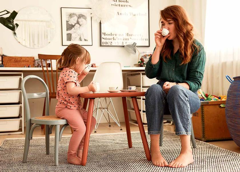 Woman and child having a tea party