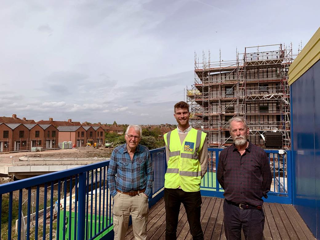 BoKlok team member in high vis with members of civic society