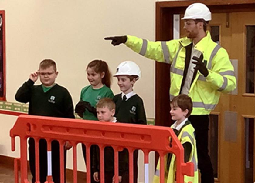 BoKlok team member in high vis with school children