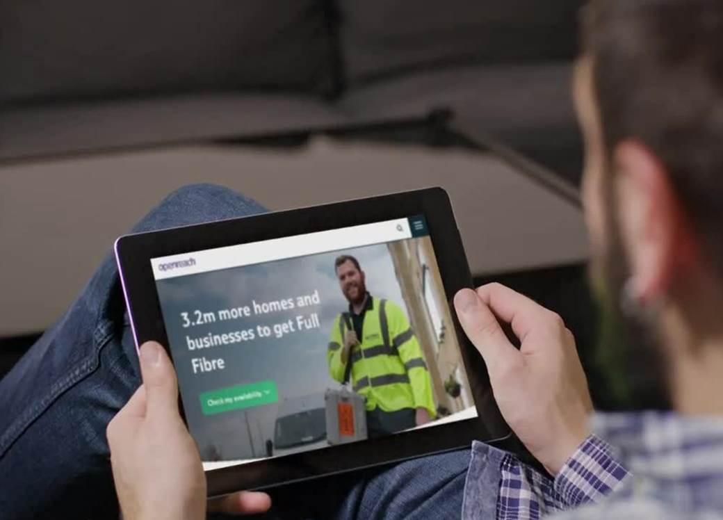 Man looking at tablet.