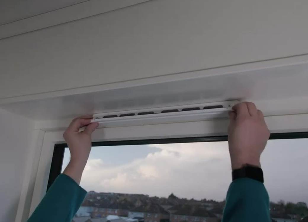 Person opening the ventilation over window.