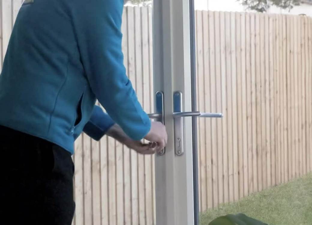 Man locking door.