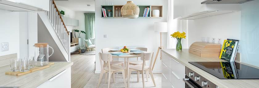 Kitchen with table and four chairs in new BoKlok home.