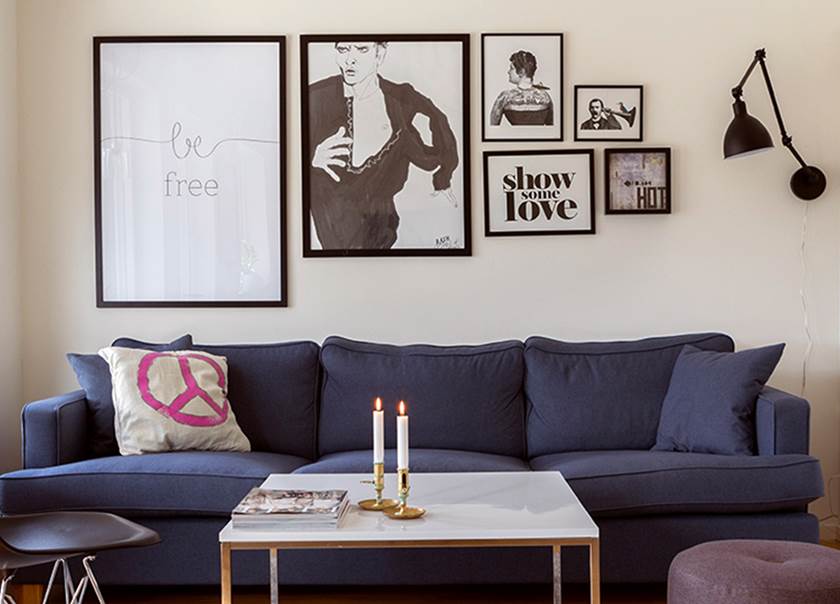 Pictures haning over sofa.