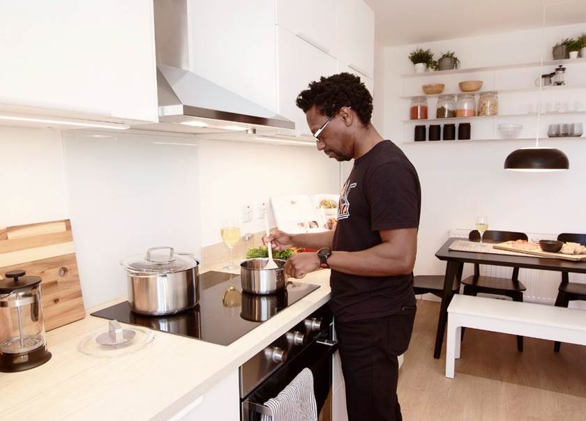 man standing in kitchen man standing in kitchen