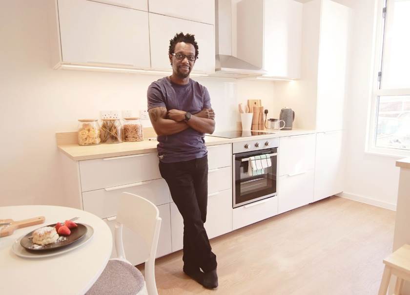 man standing in kitchen man standing in kitchen