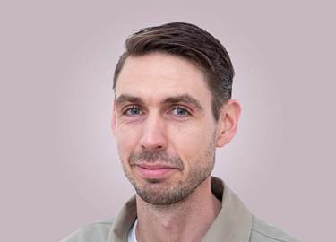 Portrait of a man in brown hair, with a beige shirt. Portrait of a man in brown hair, with a beige shirt.