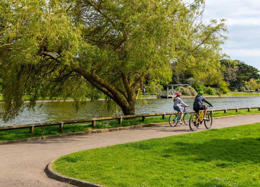 Children on bikes in park in Littlehampton.