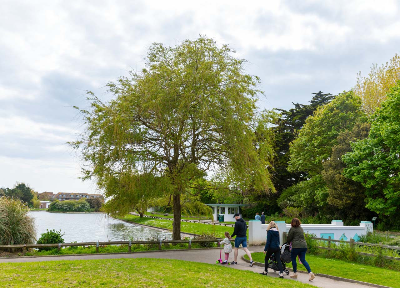 Family on walk in park in Littlehampton.