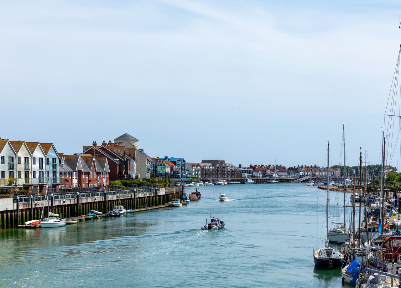 Littlehampton harbour with sailing boats.