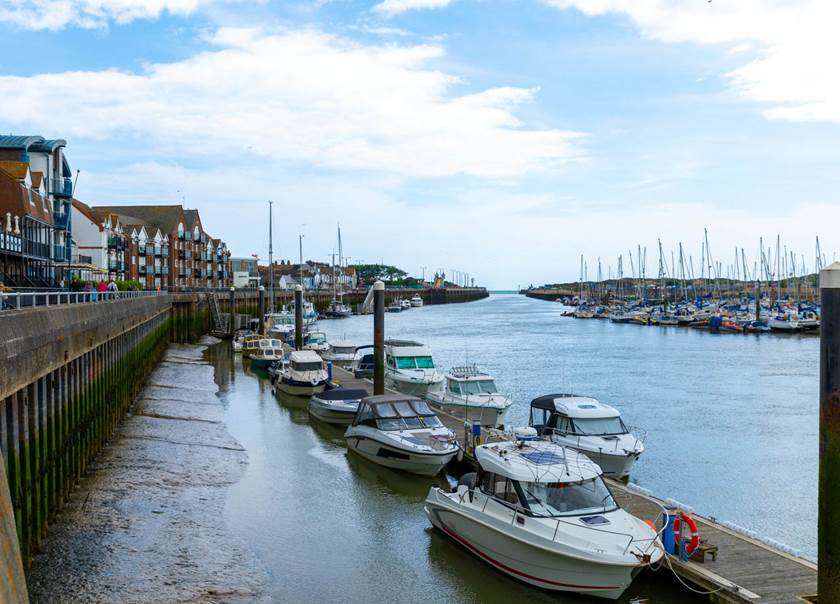 Littlehampton harbour marina with boats and buildnings.