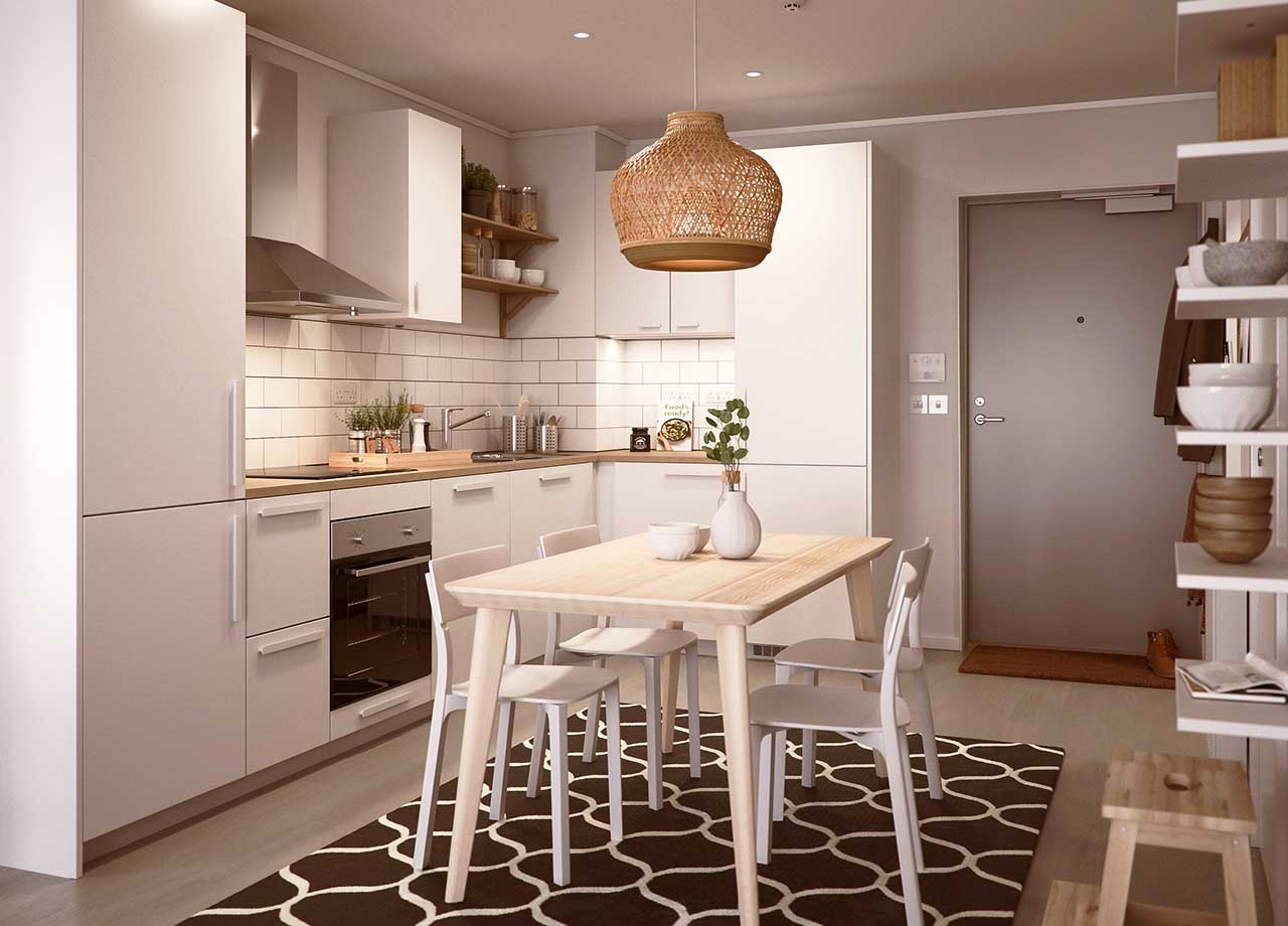 Kitchen with white cabinets and table and chairs in a type a 2 bed apartment.