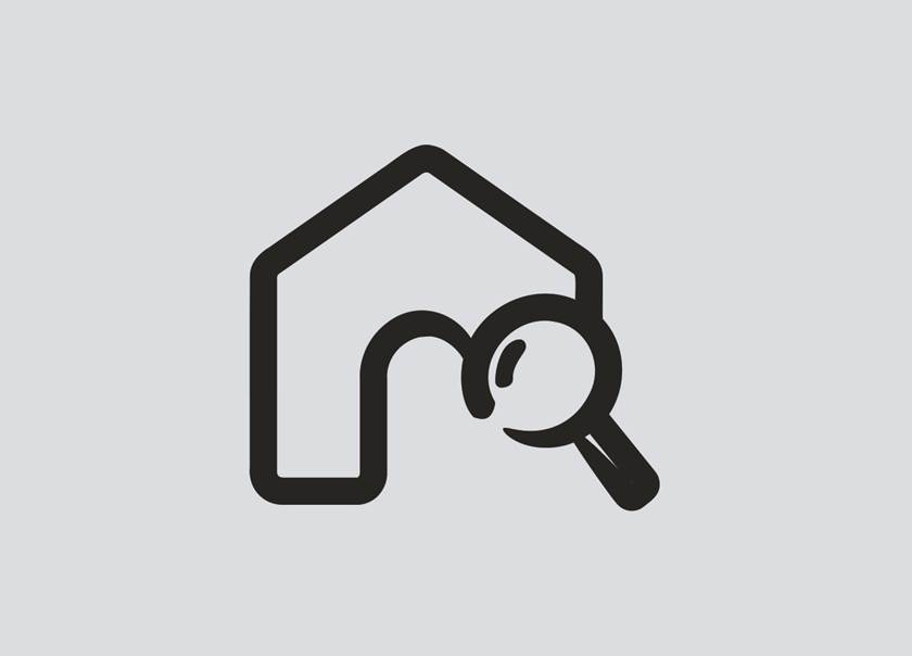 House symbol with magnifying glass
